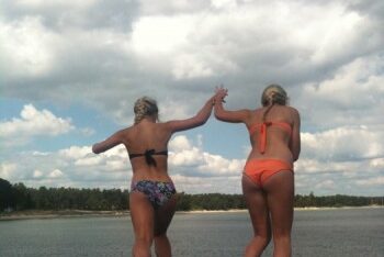 SWE Girls jumping from a pier